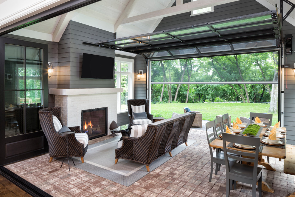 Design ideas for a transitional sunroom in Minneapolis with brick floors, a standard fireplace, a brick fireplace surround and a standard ceiling.
