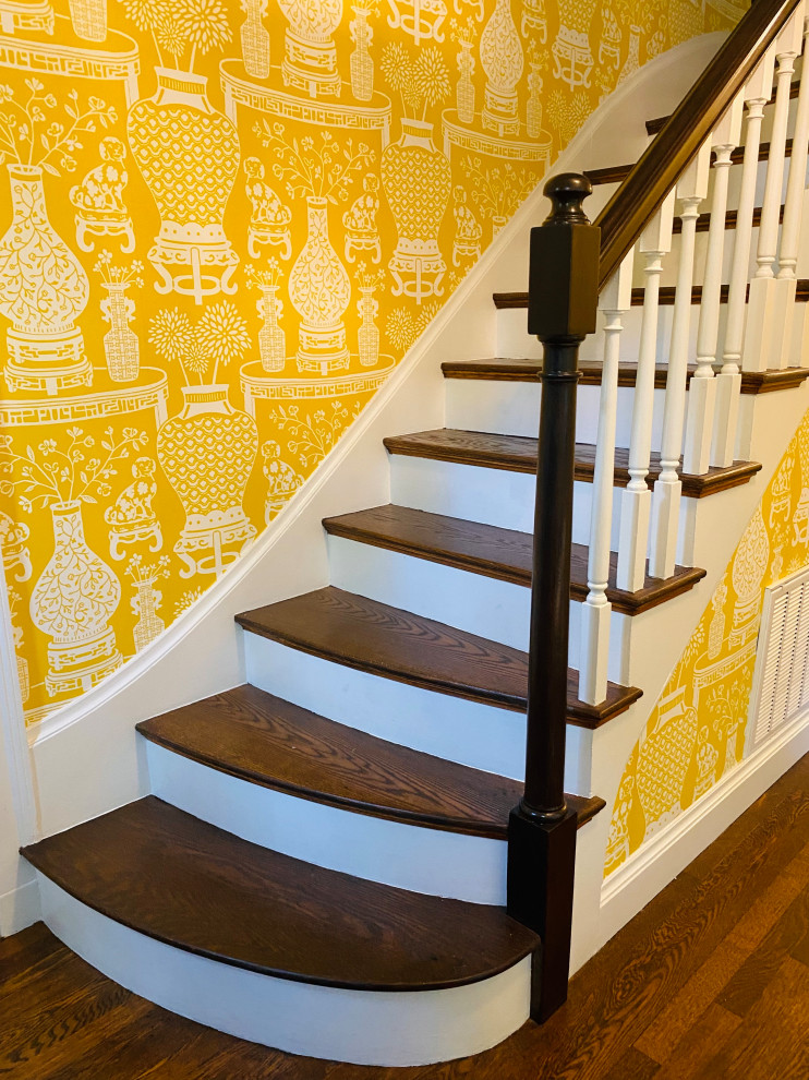 Large traditional entry hall in Boston with yellow walls, medium hardwood floors, a single front door, a blue front door, brown floor and wallpaper.