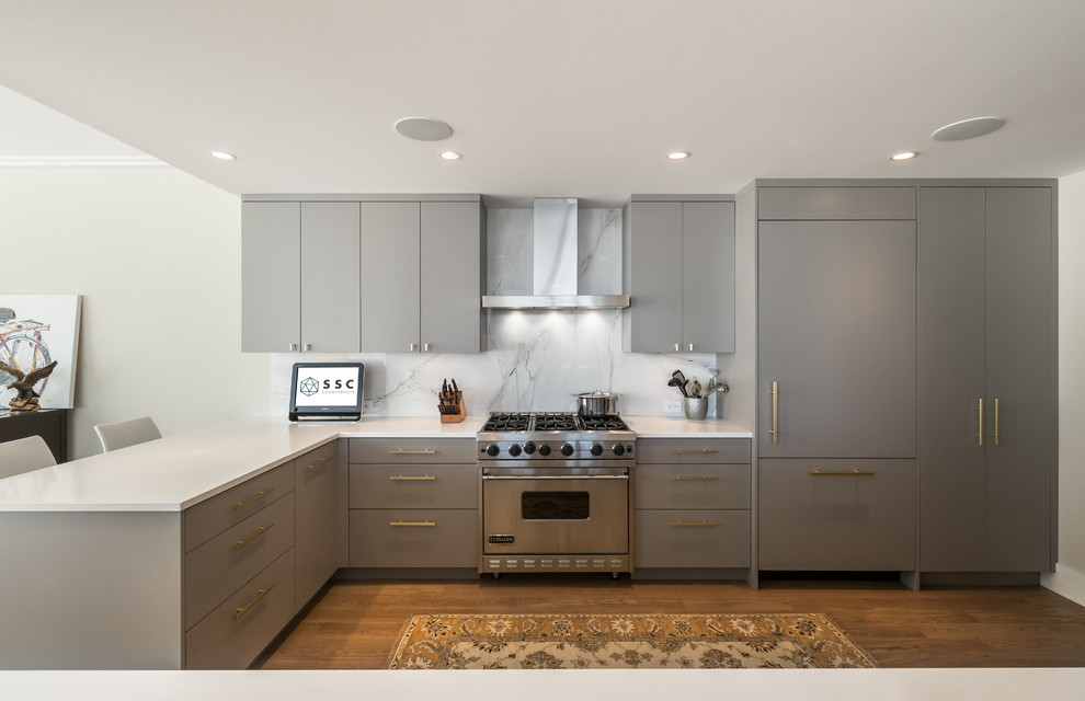 This is an example of a mid-sized contemporary kitchen in Vancouver with grey splashback and marble splashback.