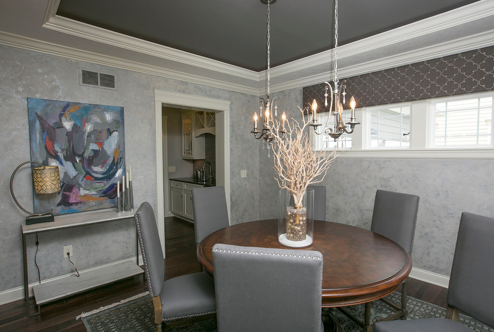 Inspiration for a transitional dining room in Columbus with grey walls and dark hardwood floors.