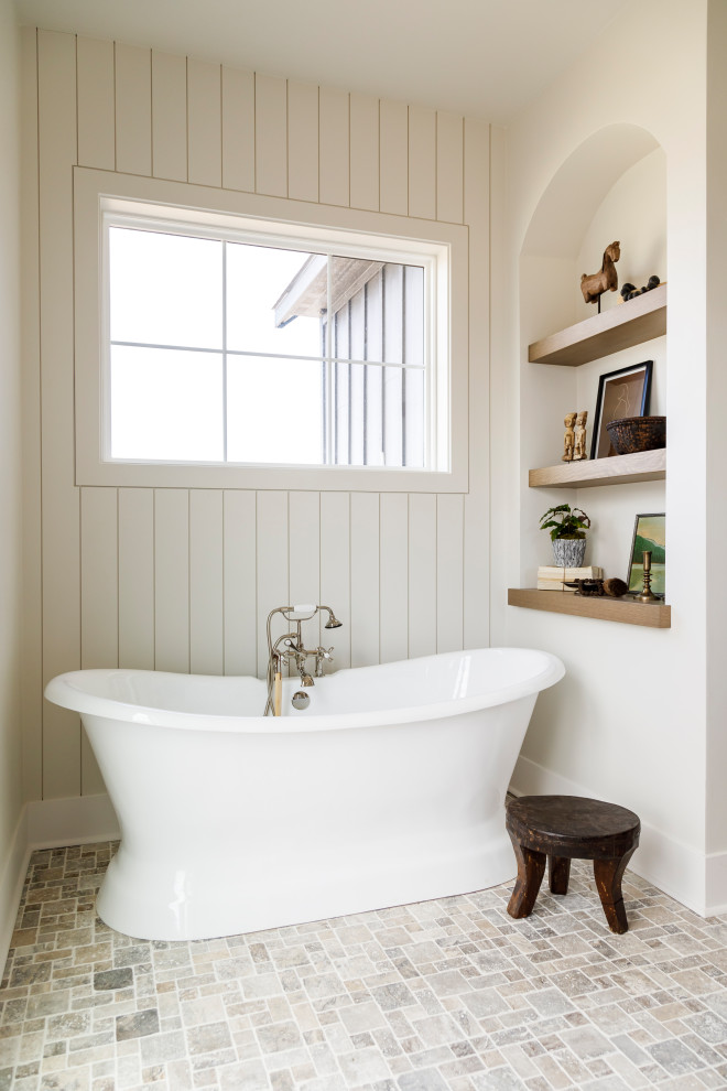 Design ideas for a medium sized farmhouse ensuite bathroom in Boise with flat-panel cabinets, medium wood cabinets, a freestanding bath, a walk-in shower, porcelain tiles, white walls, travertine flooring, a submerged sink, engineered stone worktops, an open shower, white worktops, double sinks, a floating vanity unit and tongue and groove walls.