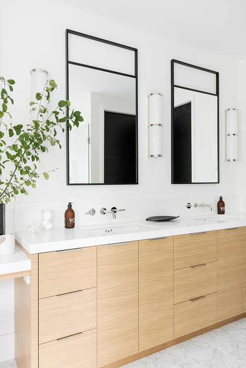 Large modern master bathroom in Salt Lake City with light wood cabinets, a corner shower, white walls, a hinged shower door and white benchtops.
