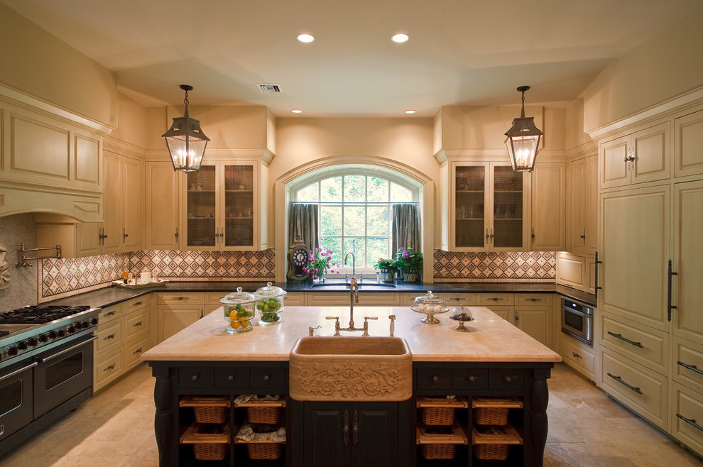 Photo of a large traditional u-shaped eat-in kitchen in Houston with a farmhouse sink, beaded inset cabinets, beige cabinets, multi-coloured splashback, stainless steel appliances and with island.