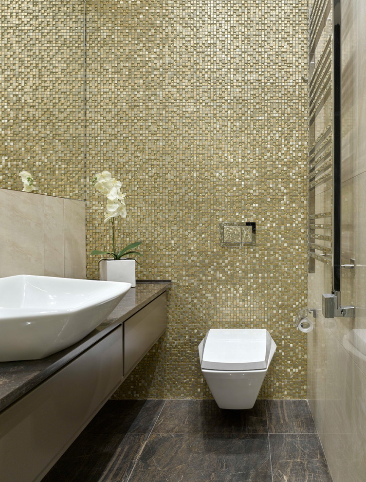 Photo of a contemporary powder room in Moscow with flat-panel cabinets, a wall-mount toilet, mosaic tile, a vessel sink, brown floor, brown cabinets and brown benchtops.