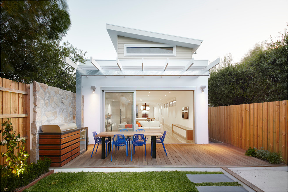 Design ideas for a mid-sized contemporary backyard patio in Melbourne with decking and a pergola.