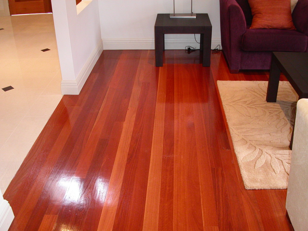 Design ideas for an eclectic living room in Sydney with medium hardwood floors.