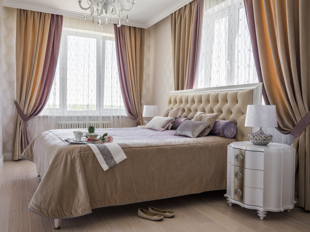 Master bedroom in Moscow with beige walls, light hardwood floors and beige floor.