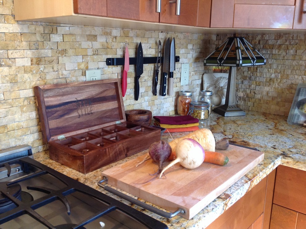 Inspiration for a craftsman kitchen remodel in Boston with recessed-panel cabinets, medium tone wood cabinets, granite countertops, beige backsplash, stone tile backsplash and stainless steel appliances