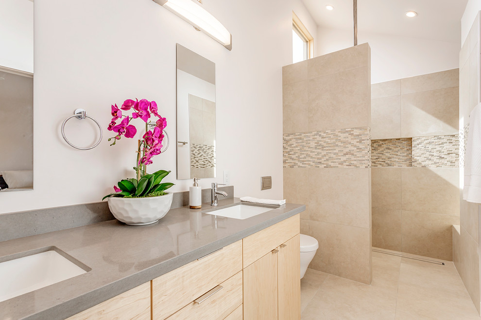 Inspiration for a contemporary master wet room bathroom in Phoenix with flat-panel cabinets, light wood cabinets, a wall-mount toilet, white tile, porcelain tile, white walls, porcelain floors, an undermount sink, engineered quartz benchtops, beige floor and an open shower.