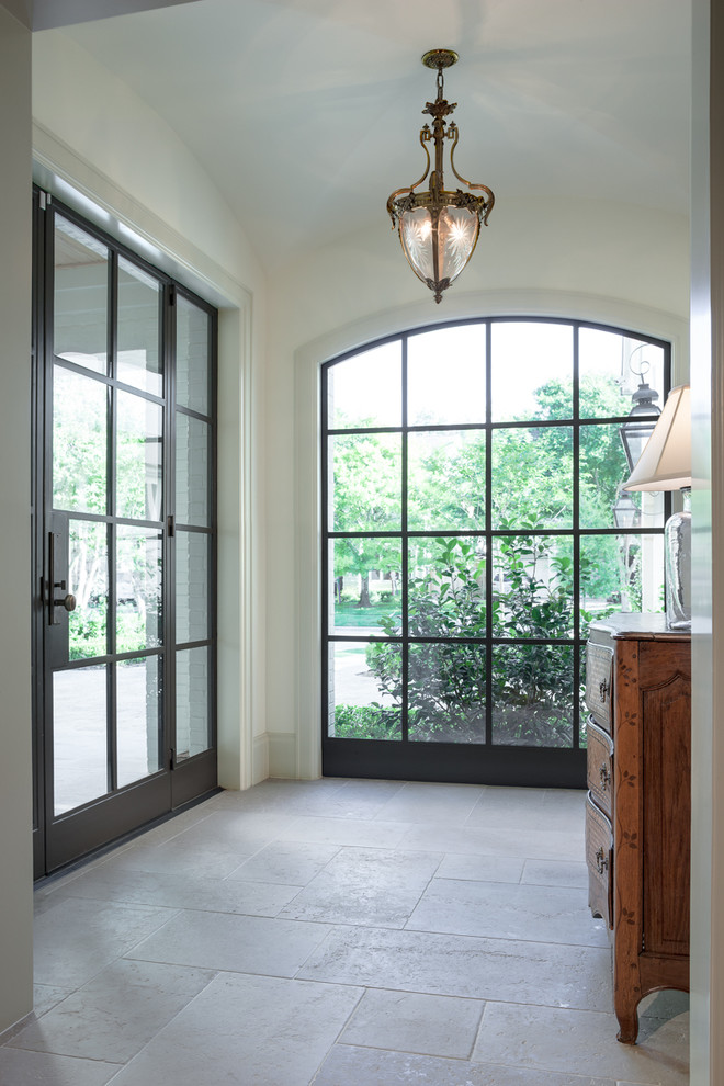 Design ideas for a traditional vestibule in Houston with white walls.