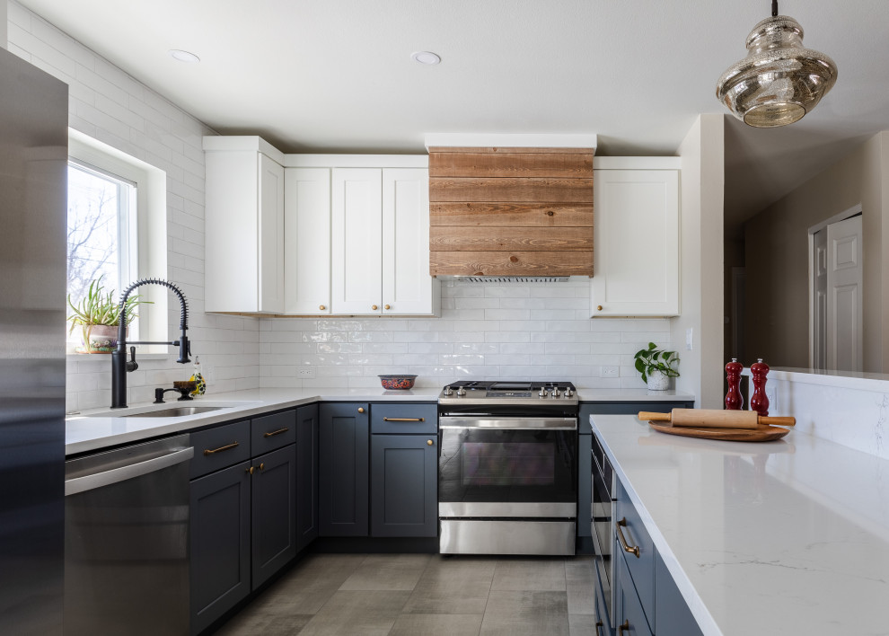 Example of a transitional kitchen design in Denver
