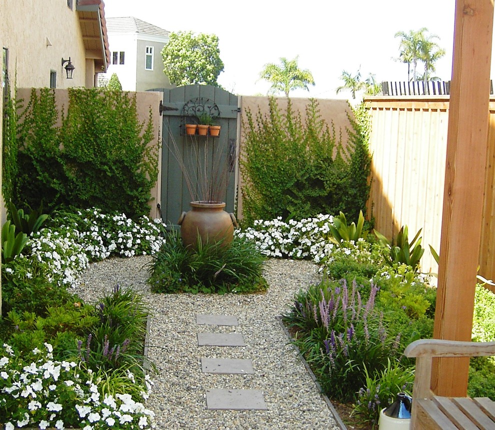 Small mediterranean side yard formal garden in San Diego.