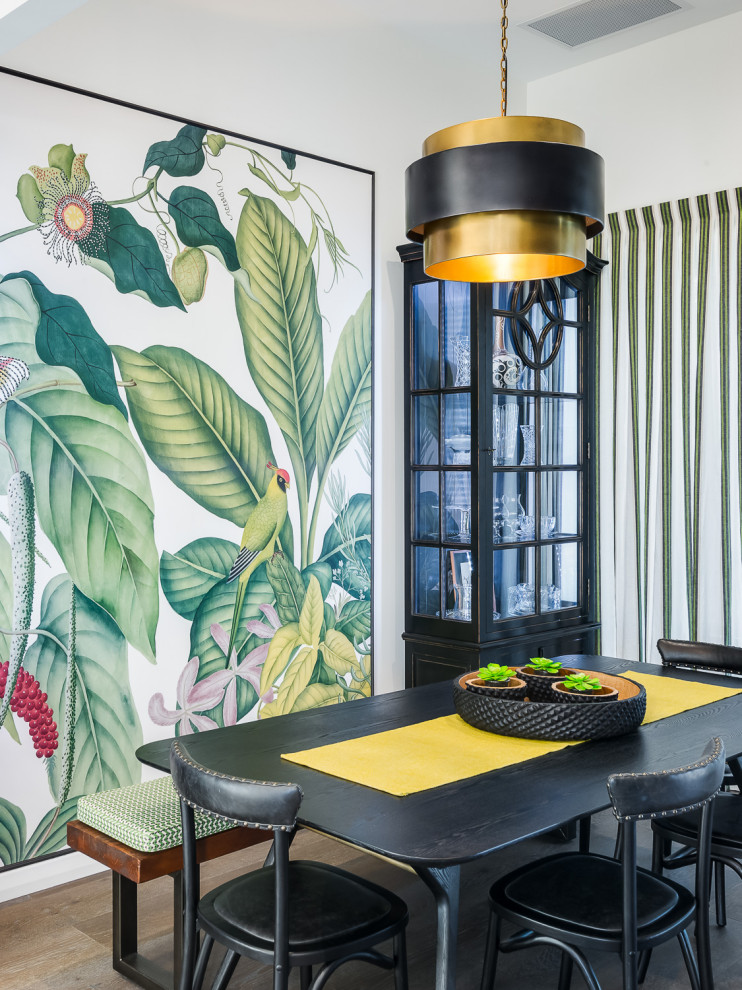 Inspiration for a contemporary dining room in Brisbane with multi-coloured walls, medium hardwood floors and brown floor.