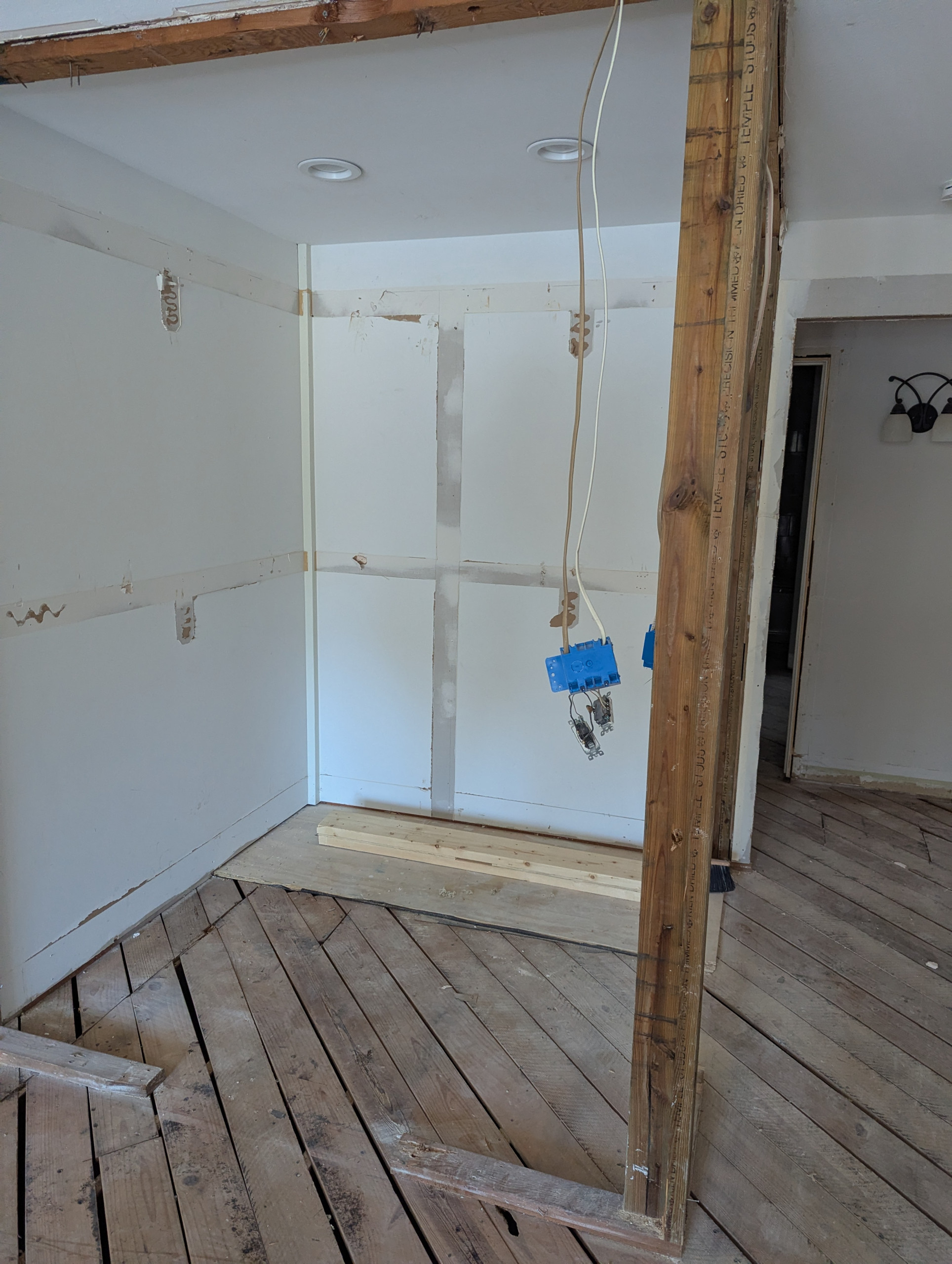 Utility Lines : Sorting - Connections	Close-up of electrical boxes and pigtails hanging from a temporary support post. This "gut" stage is the only time to perfectly map and replace outdated wiring