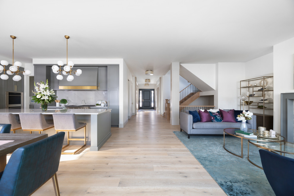 Inspiration for a transitional l-shaped open concept kitchen remodel in Calgary with an island