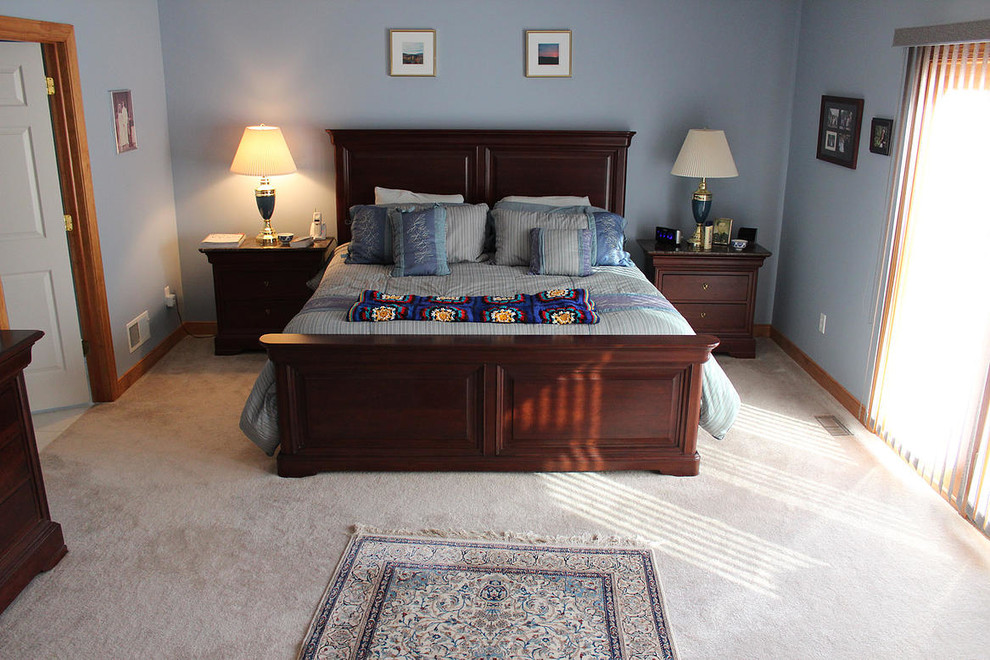 Example of a master carpeted bedroom design in DC Metro with blue walls