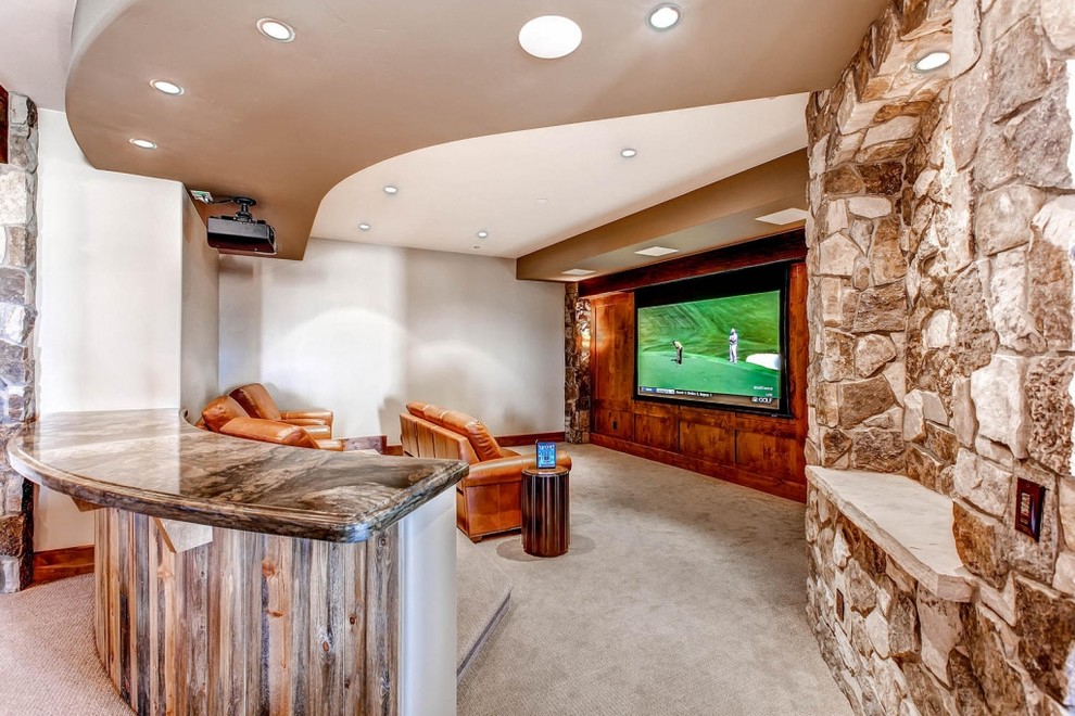 Inspiration for a mid-sized country open concept home theatre in Denver with multi-coloured walls, carpet and a projector screen.
