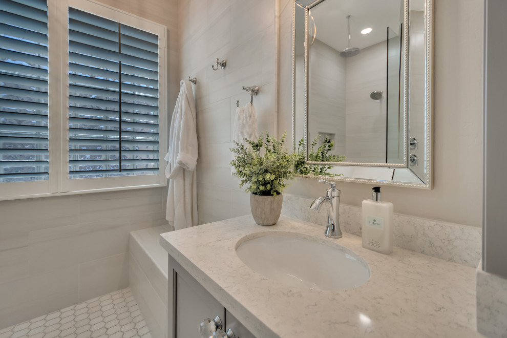 Example of a mid-sized transitional master white tile and porcelain tile wood-look tile floor, multicolored floor and double-sink doorless shower design in Phoenix with shaker cabinets, gray cabinets, gray walls, an undermount sink, granite countertops, white countertops and a niche