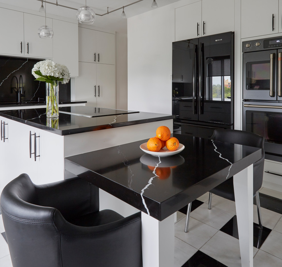 Photo of a medium sized contemporary kitchen/diner in Chicago with flat-panel cabinets, white cabinets, engineered stone countertops, black splashback, an island and black worktops.