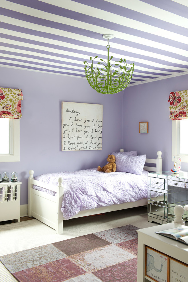Design ideas for a transitional kids' bedroom for kids 4-10 years old and girls in New York with purple walls.