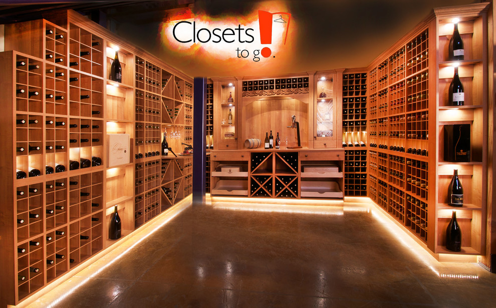 Inspiration for a large traditional wine cellar in Portland with concrete floors and storage racks.