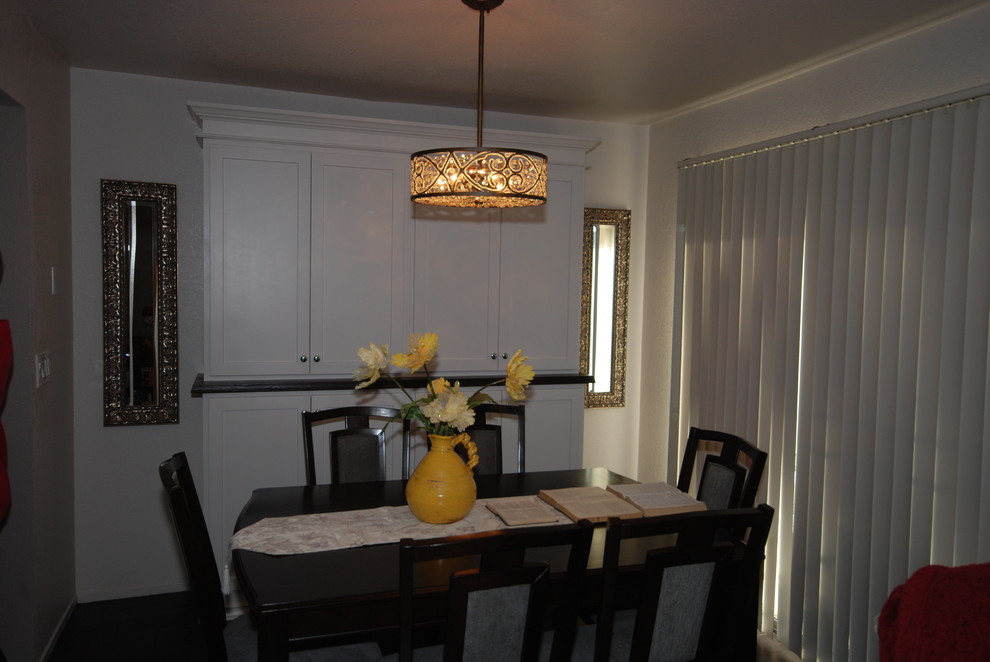 Kitchen/dining room combo - small transitional u-shaped porcelain tile kitchen/dining room combo idea with a farmhouse sink, shaker cabinets, white cabinets, quartz countertops, white backsplash, subway tile backsplash, stainless steel appliances and gray walls