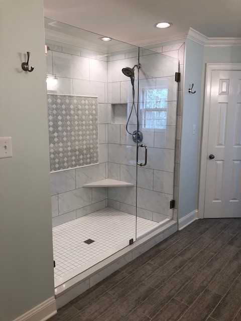 Mid-sized transitional master white tile and porcelain tile porcelain tile and gray floor alcove shower photo with recessed-panel cabinets, gray cabinets, a two-piece toilet, an undermount sink, quartzite countertops, a hinged shower door and white countertops