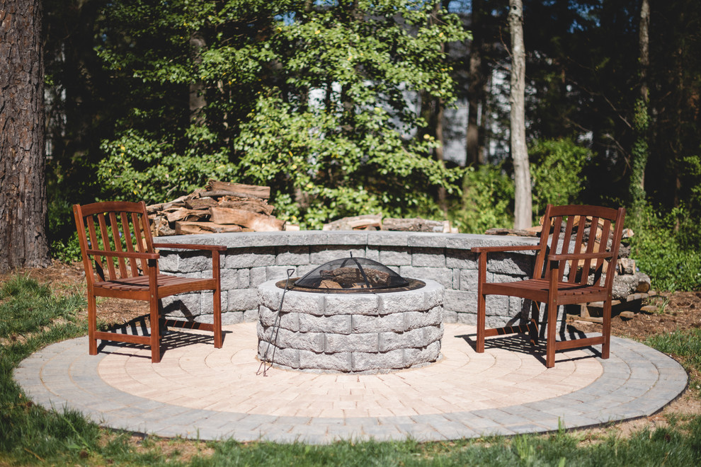 Photo of a small traditional backyard patio in Richmond with a fire feature, brick pavers and no cover.