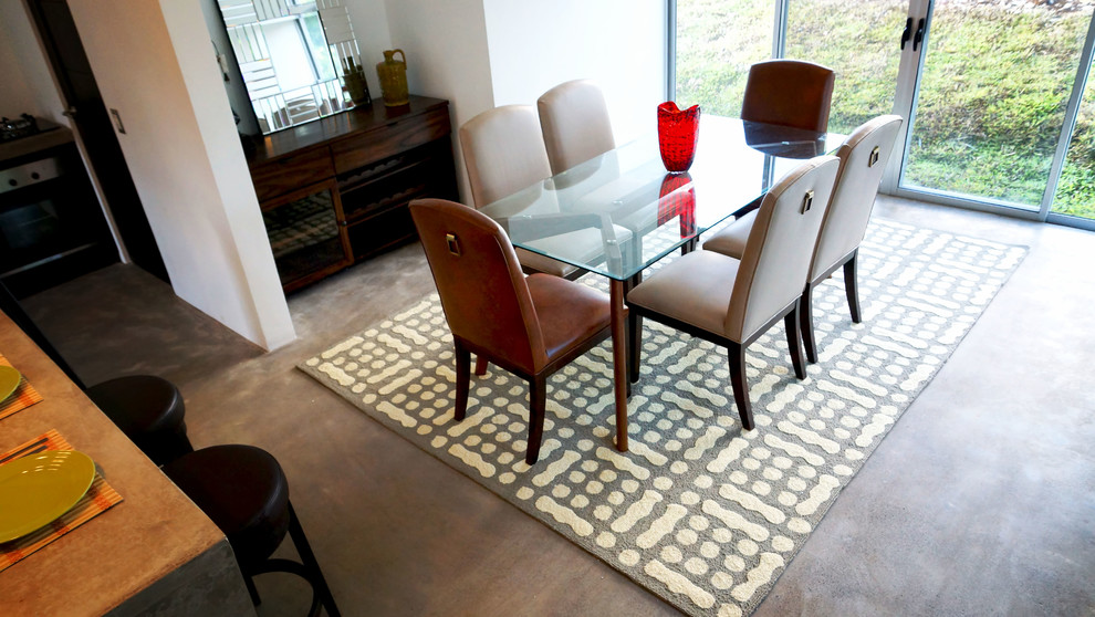 Inspiration for a transitional concrete floor great room remodel with white walls