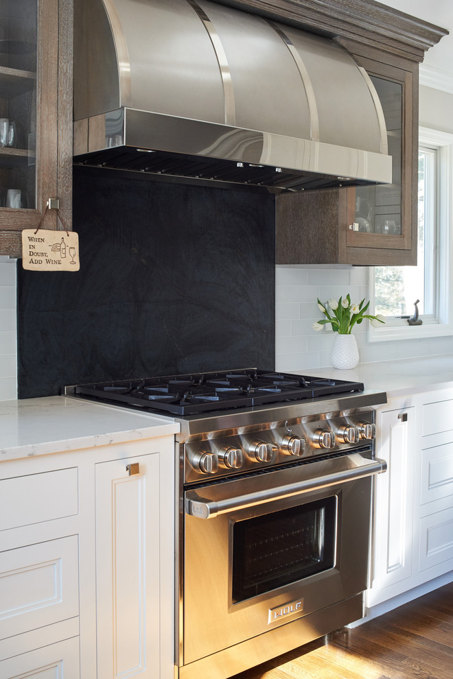 Example of a transitional kitchen design in New York