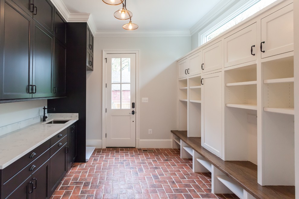 Inspiration for a transitional hallway in DC Metro with white walls, brick floors and red floor.