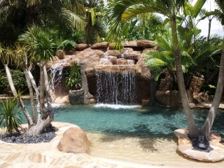 Cascading Rock Waterfall Pool feature tropical-pool
