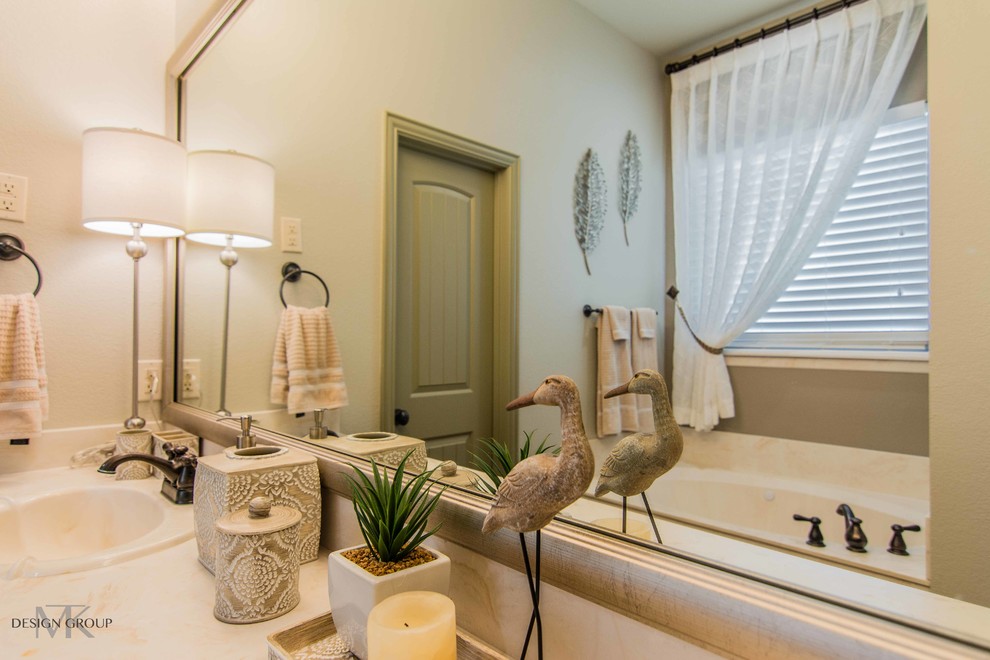 This is an example of a traditional ensuite bathroom in Dallas with beige tiles.