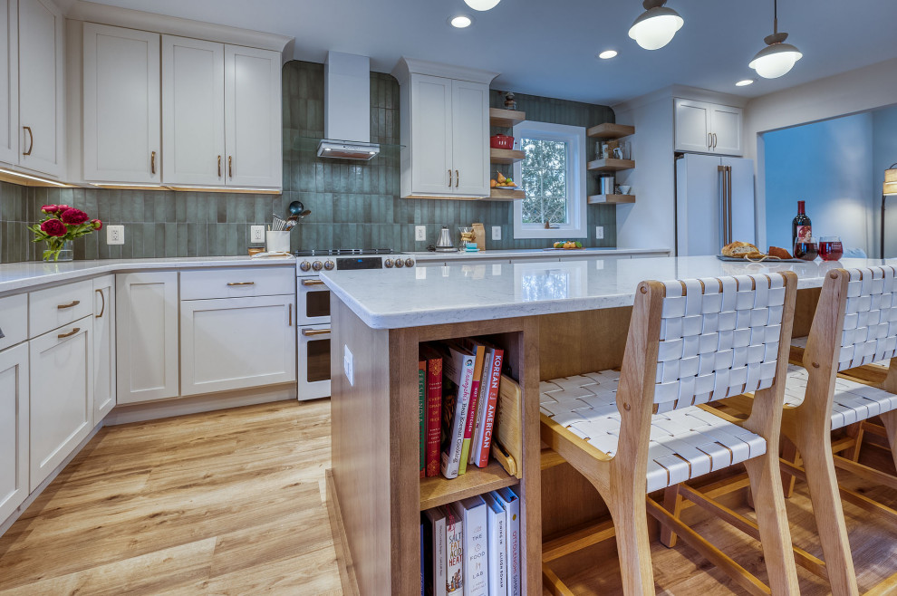 Large transitional kitchen photo in DC Metro with flat-panel cabinets, white cabinets, quartz countertops, green backsplash, ceramic backsplash, an island and white countertops