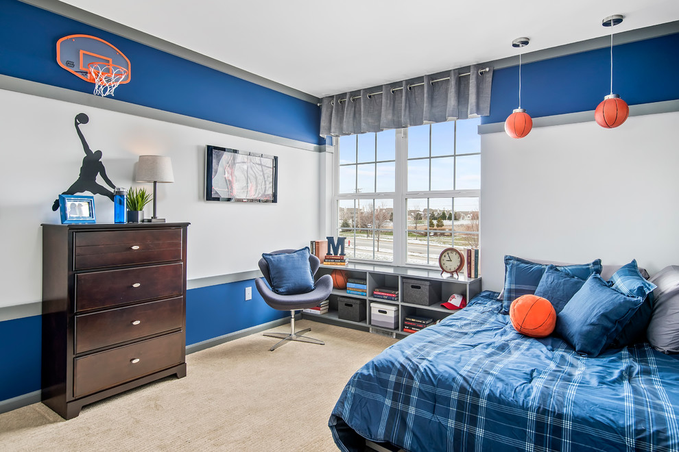 This is an example of a mid-sized transitional kids' room for boys in Chicago with carpet, beige floor and multi-coloured walls.