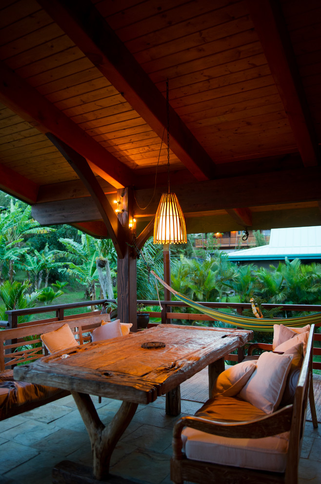 Photo of a tropical verandah in Hawaii with a roof extension.