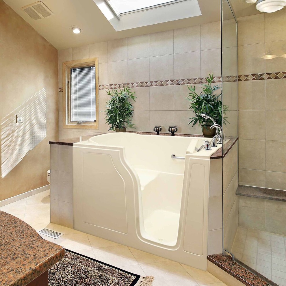 Design ideas for a large traditional master bathroom in Los Angeles with raised-panel cabinets, medium wood cabinets, a freestanding tub, a corner shower, beige walls, a wall-mount sink, beige floor and a hinged shower door.