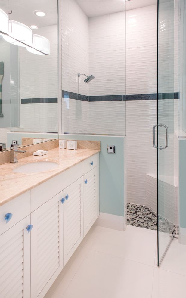 This is an example of a mid-sized transitional kids bathroom in Miami with louvered cabinets and white cabinets.