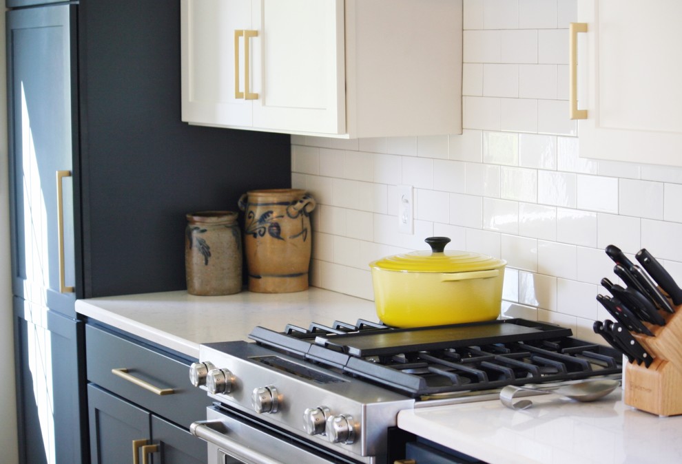 Inspiration for a transitional gray floor kitchen remodel with a farmhouse sink, quartz countertops and stainless steel appliances