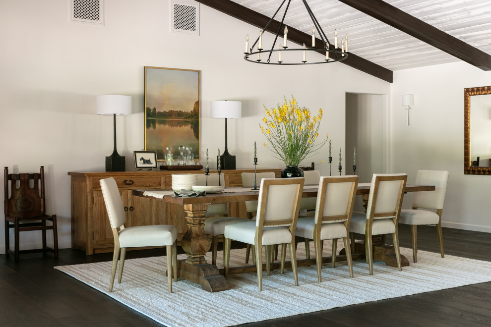 Large tuscan dark wood floor, brown floor and exposed beam great room photo in Santa Barbara with white walls