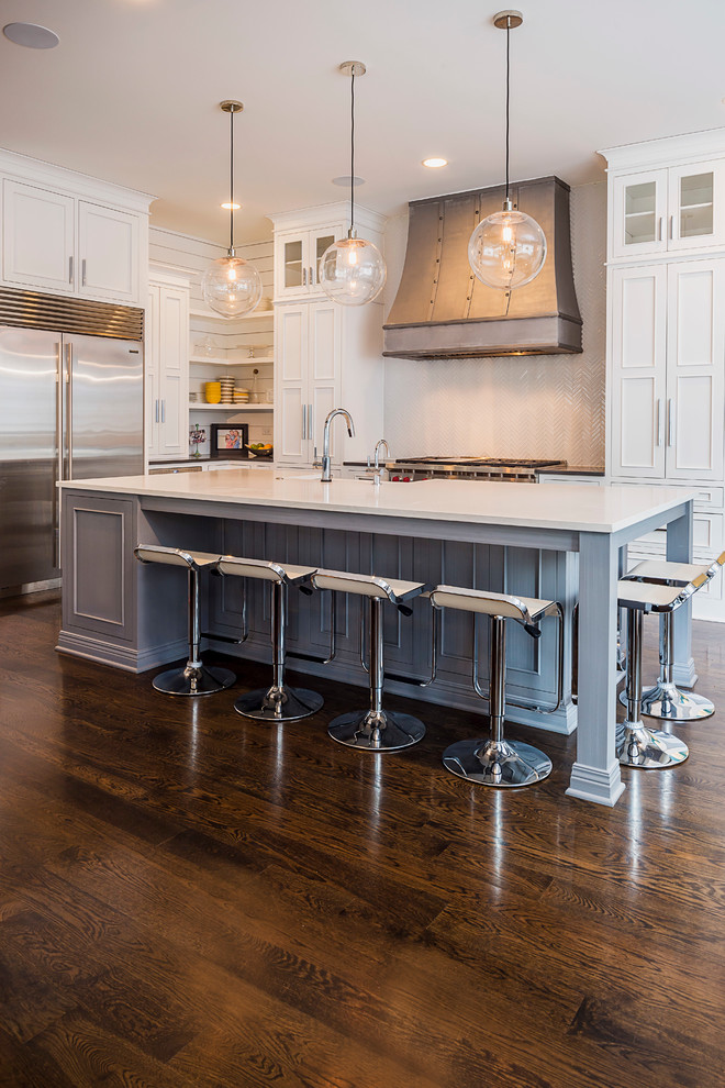 Inspiration for a small transitional l-shaped medium tone wood floor eat-in kitchen remodel in Chicago with a farmhouse sink, flat-panel cabinets, white cabinets, stainless steel appliances and an island