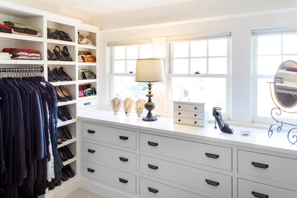 Inspiration for a large traditional women's dressing room in Portland with flat-panel cabinets, white cabinets and ceramic floors.