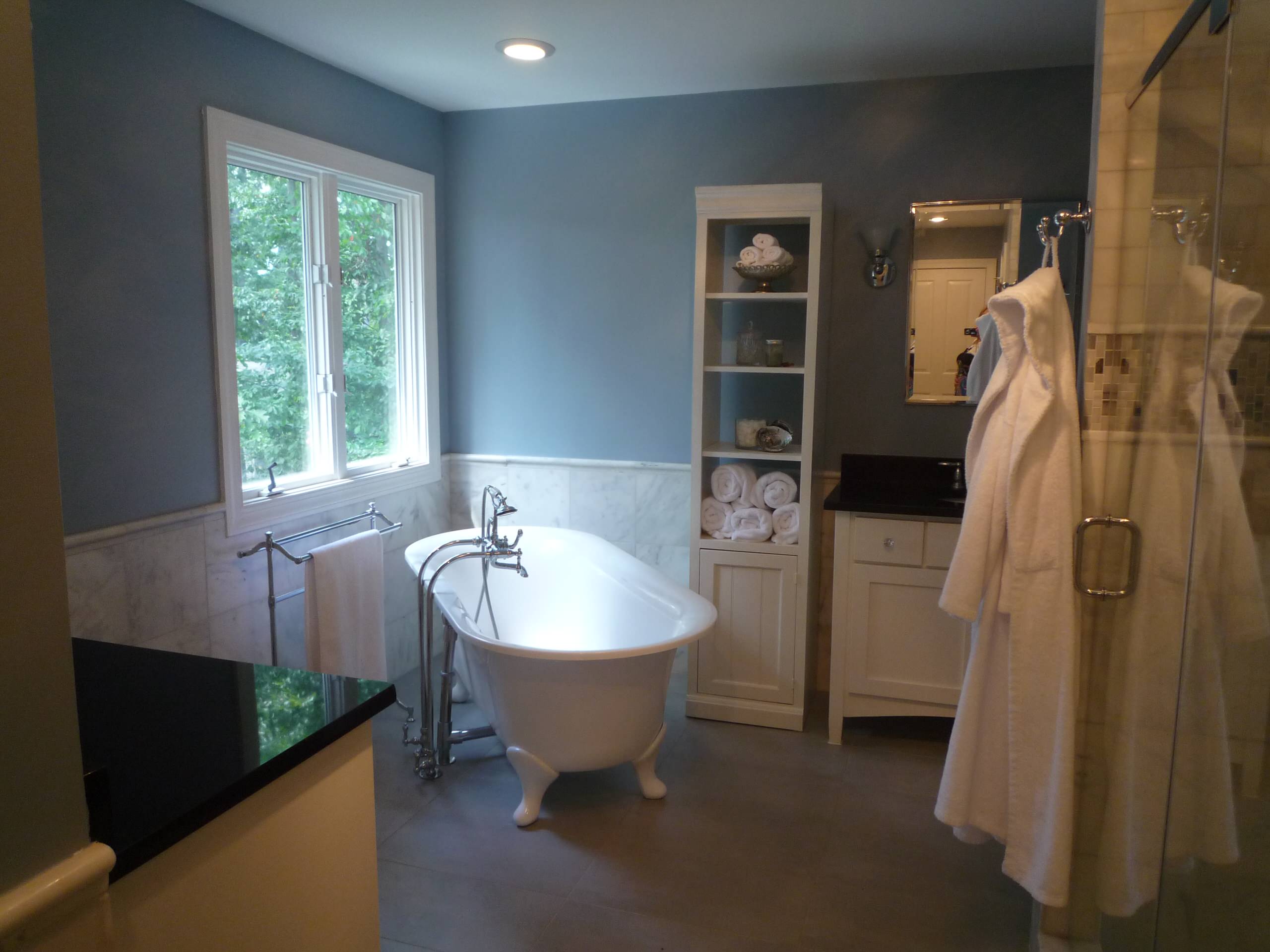 White Marble Blue walls bath in McLean