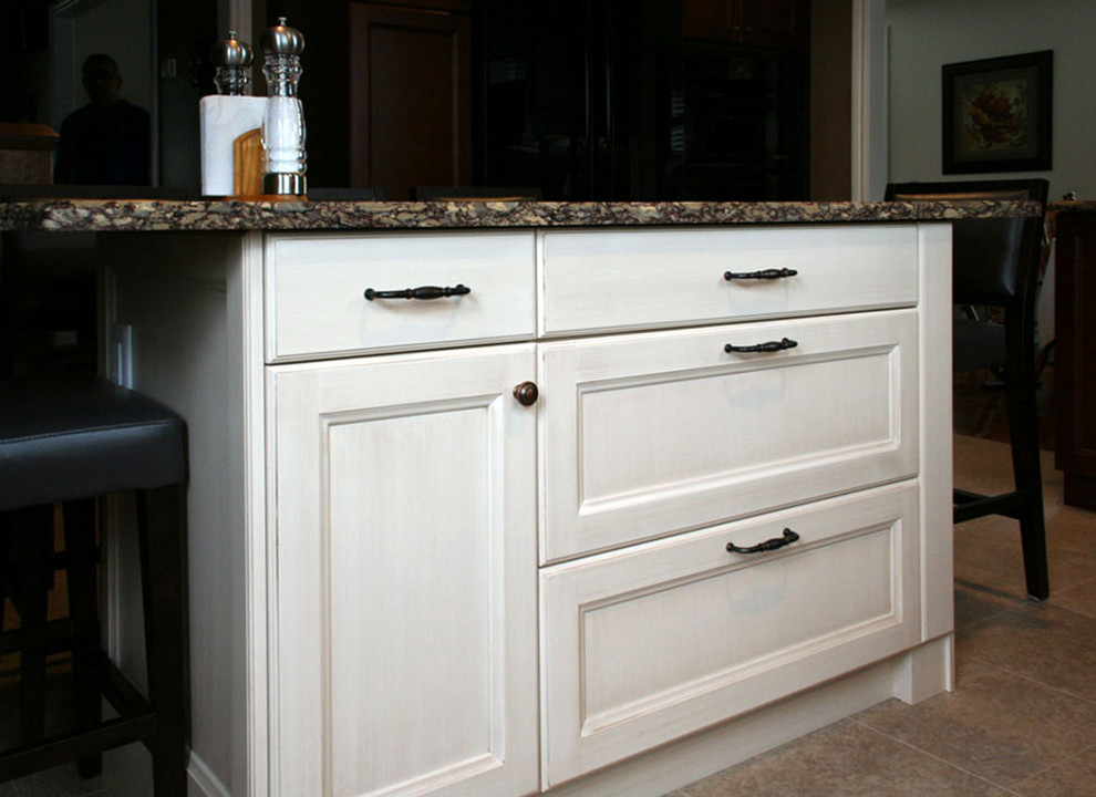Example of a mid-sized transitional l-shaped linoleum floor enclosed kitchen design in Toronto with an undermount sink, shaker cabinets, medium tone wood cabinets, quartz countertops, gray backsplash, ceramic backsplash, black appliances and an island