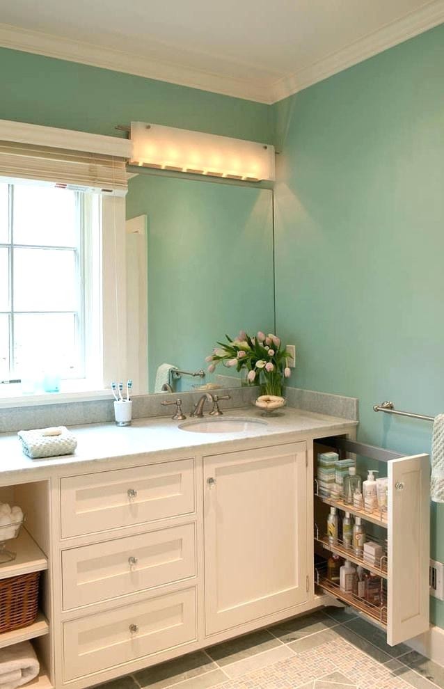 Inspiration for a mid-sized traditional bathroom in Houston with recessed-panel cabinets, white cabinets, blue walls, ceramic floors, an undermount sink, grey floor and grey benchtops.