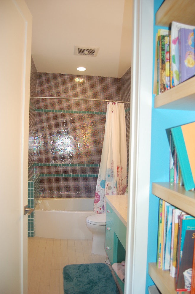 Design ideas for a small contemporary kids bathroom in San Francisco with flat-panel cabinets, turquoise cabinets, a shower/bathtub combo, a one-piece toilet, grey walls, porcelain floors, an undermount sink, beige floor and a shower curtain.