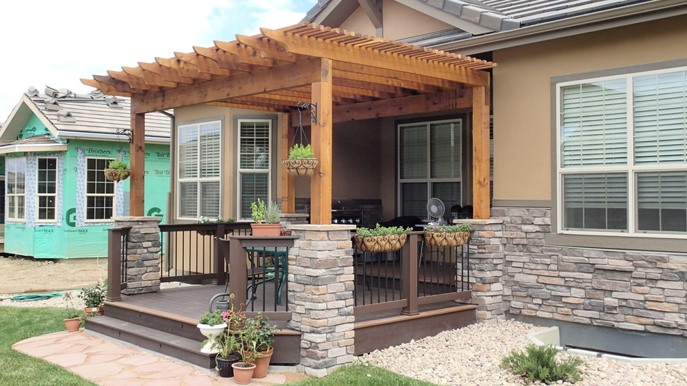 Deck - small traditional backyard deck idea in Denver with a pergola
