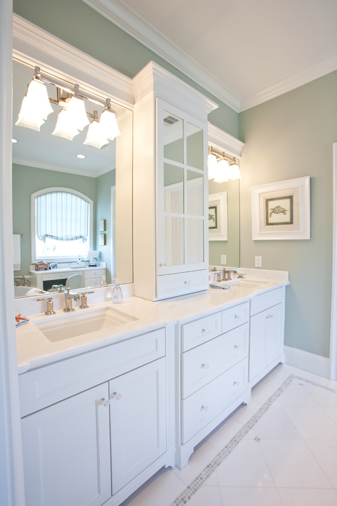 Design ideas for a large beach style 3/4 bathroom in Houston with an undermount sink, shaker cabinets, white cabinets, white tile, porcelain tile, green walls and porcelain floors.