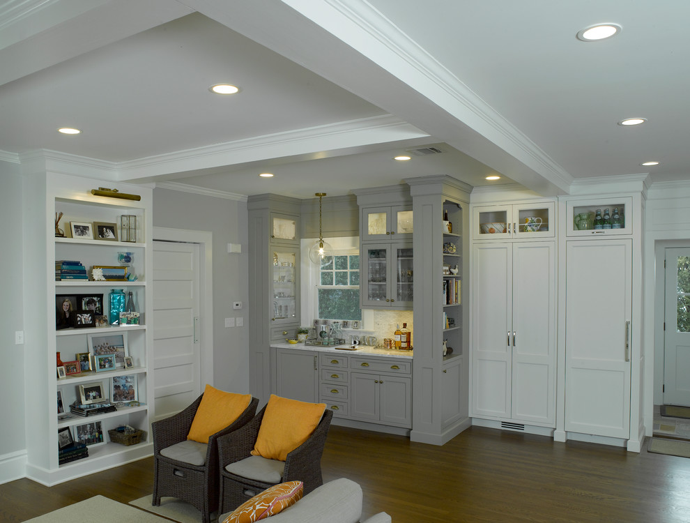 Example of a large transitional l-shaped dark wood floor open concept kitchen design in New York with flat-panel cabinets, white cabinets, marble countertops, white backsplash, marble backsplash and an island