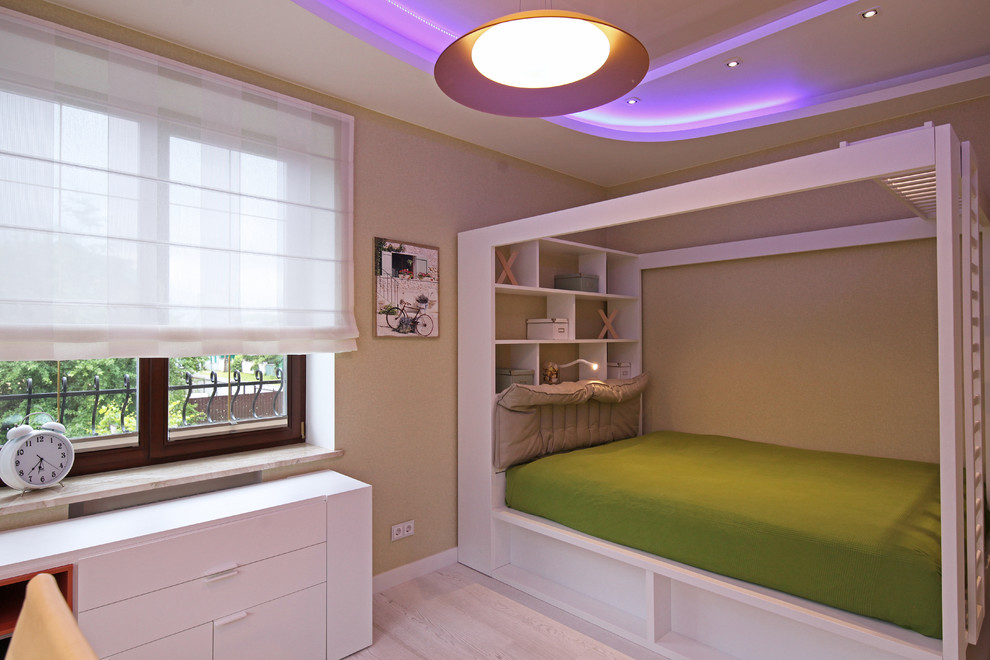 Mid-sized contemporary kids' room in Other with multi-coloured walls and light hardwood floors for girls.